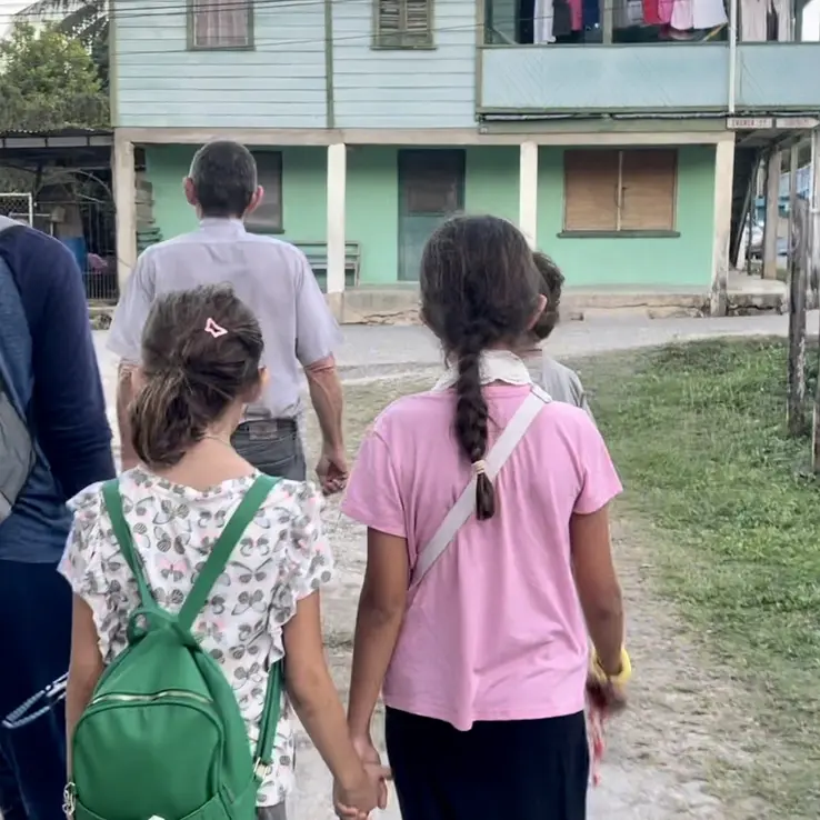 Catholic SOLT laity walking to Church